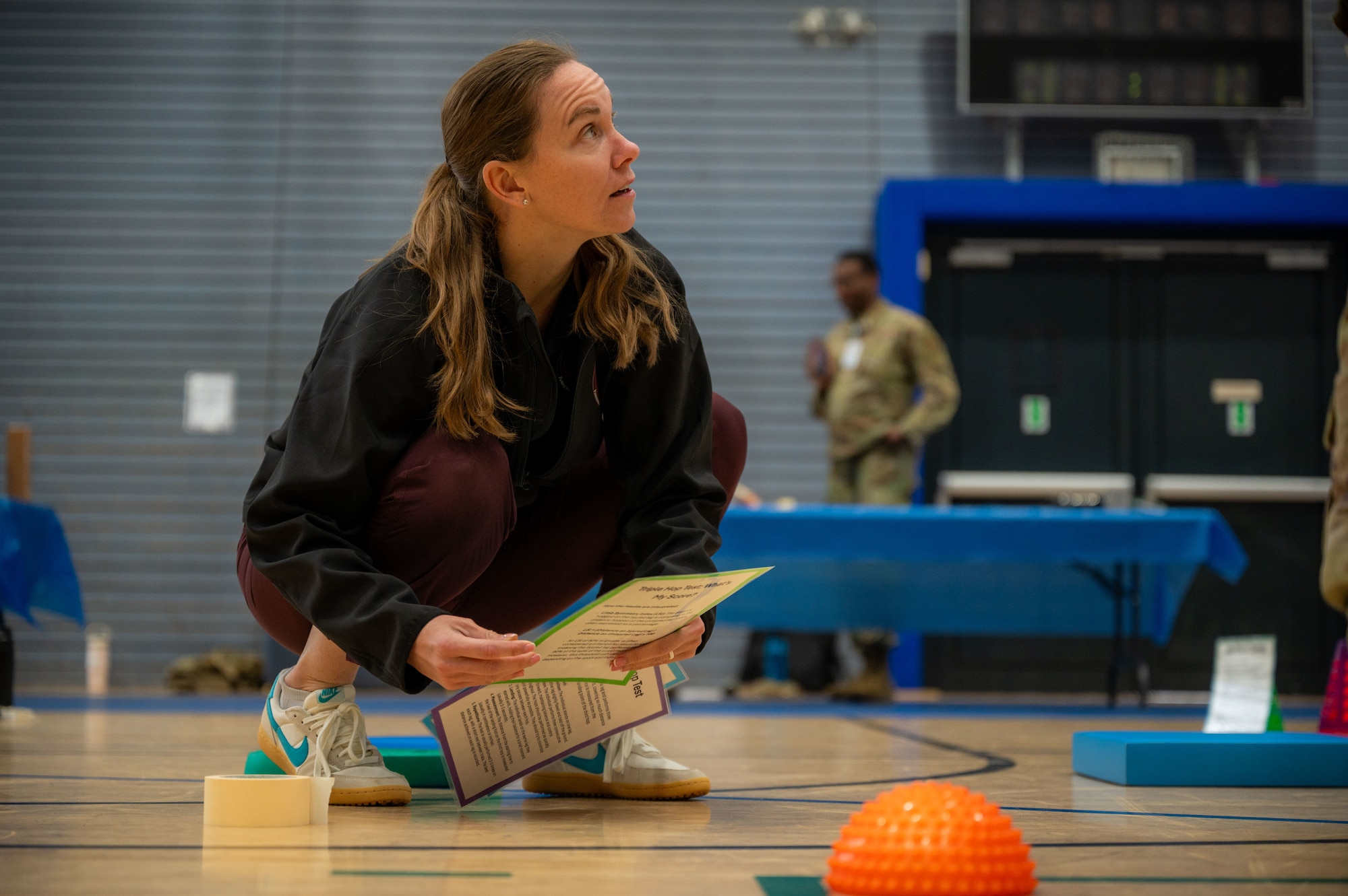 U.S. Air Force Maj. Michelle Larrea, 86th Medical Group physical therapist, sets up a physical training station during the October PT Month Health Fair at Ramstein Air Base, Germany, Oct. 17, 2025.