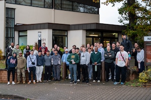 Participants from the Airman 4 Life event pose for a group photo outside of the Northside Chapel on Ramstein Air Base, Germany, Oct. 27, 2025.