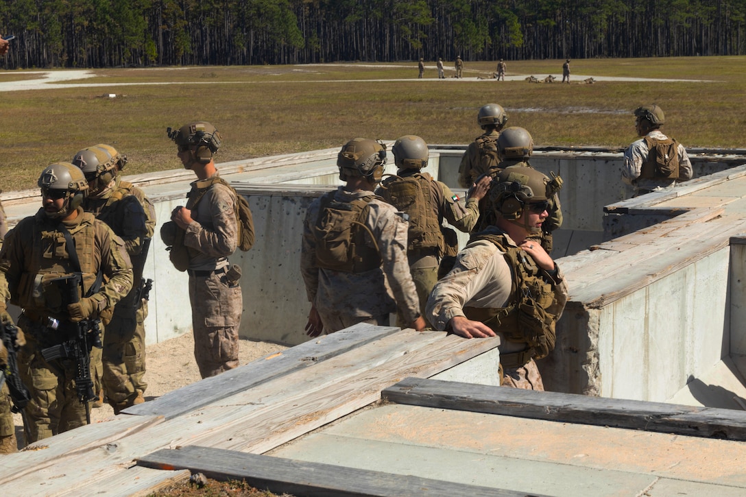 U.S Marines with 2nd Battalion 6th Marine Regiment 2nd Marine Division and UAE Soldiers prepare to conduct a dry fire platoon attack on a fortified point as part of Unit Enhancement Training 2-25 on Marine Corps Base Camp Lejeune, North Carolina, Oct 23, 2025.UET2-25 is a bilateral training exercise conducted to improve interoperability and strengthen partner nation relations between the U.S. Marine Corps and the UAE.(U.S. Marine Corps photo by Cpl Xavier Alicea)