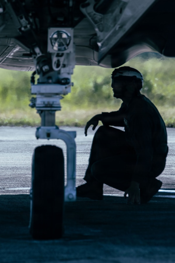 A U.S. Marine with Marine Fighter Attack Squadron (VMFA) 225, U.S. Marine Corps Forces, South, conducts pre-flight inspections under a U.S. Marine Corps F-35B Lightning II assigned to VMFA-225 at Jose Aponte de la Torre Airport in Ceiba, Puerto Rico, Nov. 11, 2025. U.S. military forces are deployed to the Caribbean in support of the U.S. Southern Command mission, Department of War-directed operations, and the president’s priorities to disrupt illicit drug trafficking and protect the homeland. (U.S. Marine Corps photo)