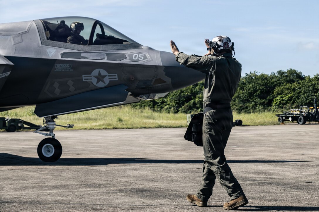 A U.S. Marine with Marine Fighter Attack Squadron (VMFA) 225, U.S. Marine Corps Forces, South, guides a U.S. Marine Corps F-35B Lightning II assigned to VMFA-225 at Jose Aponte de la Torre Airport in Ceiba, Puerto Rico, Nov. 11, 2025. U.S. military forces are deployed to the Caribbean in support of the U.S. Southern Command mission, Department of War-directed operations, and the president’s priorities to disrupt illicit drug trafficking and protect the homeland. (U.S. Marine Corps photo)