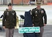 Two soldiers stand behind a street sign name MSG Gary Gordon Boulevard.