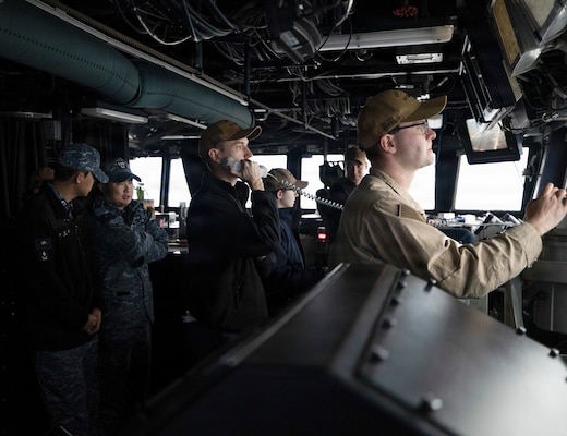 U.S. Navy Sailors and Republic of Korea (ROK) Navy Sailors collaborate on the bridge aboard Arleigh Burke-class guided-missile destroyer USS Dewey (DDG 105) during the Maritime Counter Special Operations Exercise (MCSOFEX) with the ROK Navy, Nov. 18, 2025.