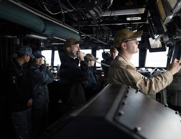 U.S. Navy Sailors and Republic of Korea (ROK) Navy Sailors collaborate on the bridge aboard Arleigh Burke-class guided-missile destroyer USS Dewey (DDG 105) during the Maritime Counter Special Operations Exercise (MCSOFEX) with the ROK Navy, Nov. 18, 2025.