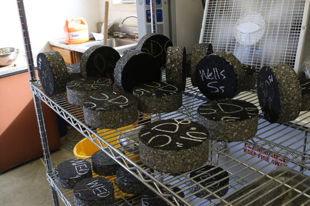 Asphalt test cores queued for density and cracking tests.