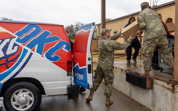 Airmen unload donated food