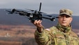 U.S. Army Staff Sgt. Luis Andujar, a Small Unmanned Aircraft Systems instructor with 1st Battalion, 166th Regiment - Regional Training Institute, Pennsylvania Army National Guard, lands a Skydio X2D SUAS during a training exercise Nov. 15, 2024 at Fort Indiantown Gap, Pa. The capabilities of the 166th Regiment RTI's 1st and 2nd Battalions melded during a unique artillery live-fire exercise, during which forward observers with 1st Battalion used several types of SUAS, including commercial off the shelf models like the Skydio X2D, to identify targets and acquire targeting data. This data was used to submit a call for fire to instructors and students with 2nd Battalion, who engaged the targets with artillery fire using M119, M777 and M109A6 howitzers. (U.S. Army National Guard photo by Sgt. 1st Class Shane Smith)