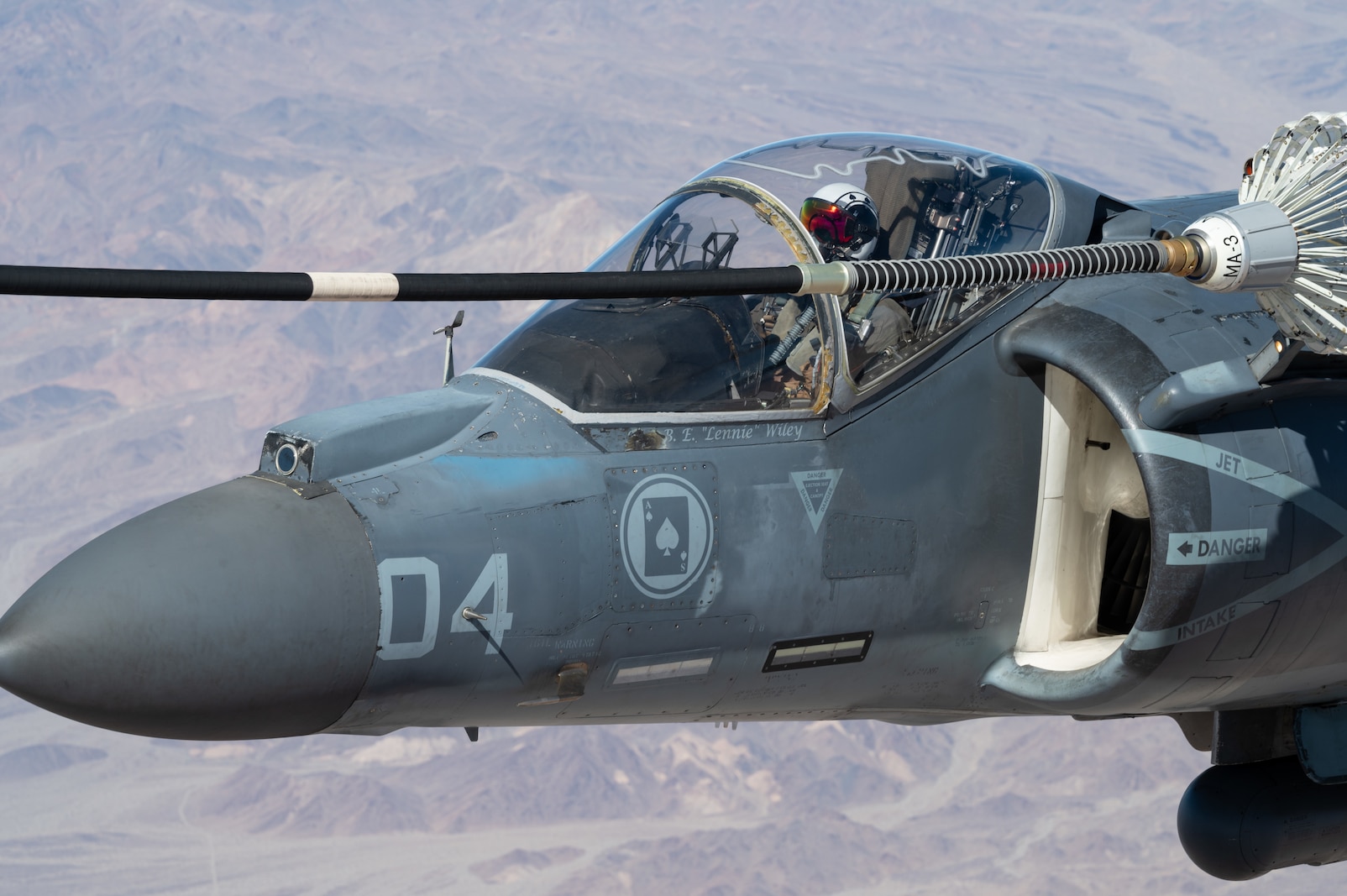 A U.S. Marine AV-8B Harrier assigned to Marine Attack squadron 231 receives fuel from an Air Force MC-130J Commando II assigned to Air Force Special Operations Command during Emerald Warrior 25.1 in Arizona, Feb. 6, 2025.  Emerald Warrior is the premier operational exercise for Air Force Special Operations Command, training combat ready forces to respond to various threats across the spectrum of conflict. (U.S. Air Force photo by Staff Sergeant Tyler McQuiston)