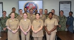 251120-N-FB730-1031 CAMP LEJEUNE. (November 20, 2025) Navy officers assigned to Expeditionary Medical Facility Kilo pose with command leadership and Nursing Residency Program staff after the Training-to-Practice Nurse Residency Program graduation, at Naval Medical Center Camp Lejeune, on November 20, 2025. The newly created six-month program orients new nurses to Navy Medicine while also emphasizing professional development and exposure to realistic clinical scenarios they are likely to encounter.