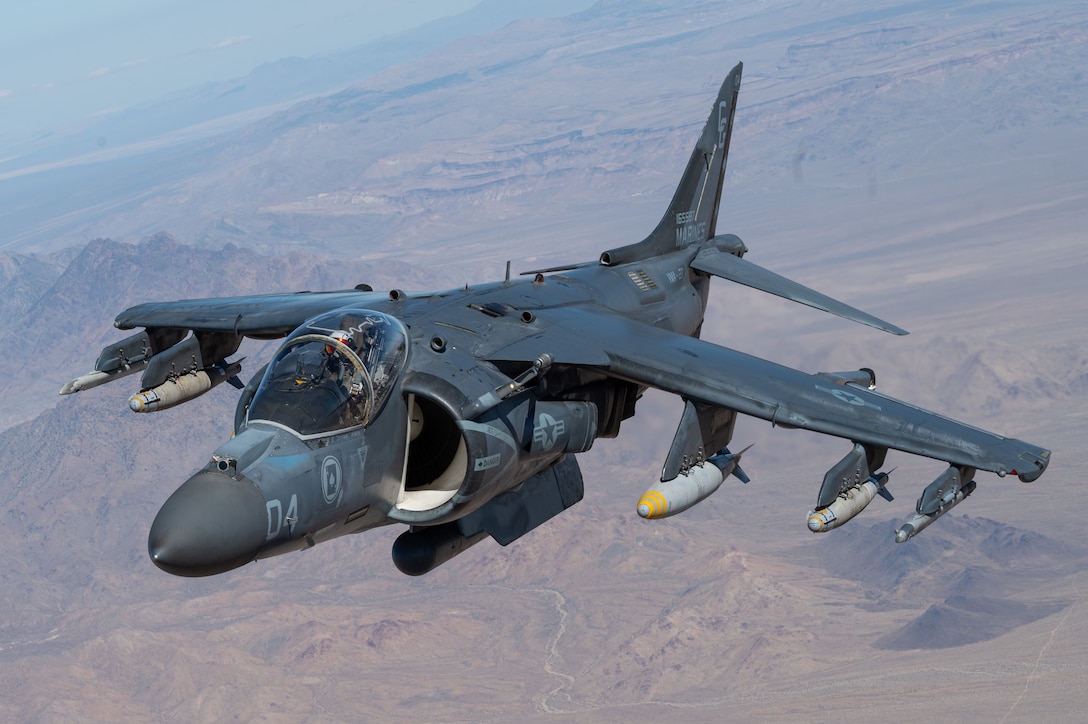 A U.S. Marine AV-8B Harrier assigned to Marine Attack Squadron 231 approaches an Air Force MC-130J Commando II assigned to Air Force Special Operations Command before obtaining fuel during Emerald Warrior 25.1 in Arizona, Feb. 6, 2025.  Emerald Warrior is the premier operational exercise for Air Force Special Operations Command, training combat ready forces to respond to various threats across the spectrum of conflict. (U.S. Air Force photo by Staff Sergeant Tyler McQuiston)