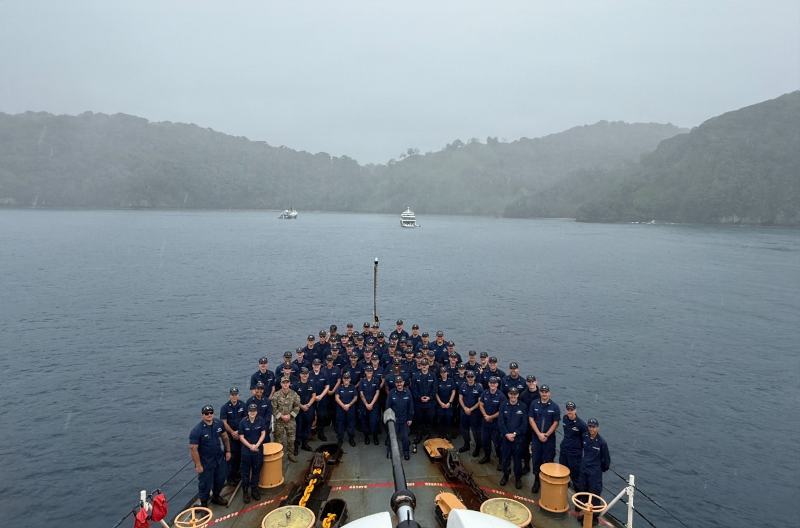 The crew of the Coast Guard Cutter Tampa poses for a group photo on the cutter in Isla de Coco, Costa Rica, Nov. 2, 2025. Tampa’s crew deployed in support of counterdrug operations in the Eastern Pacific. (U.S. Coast Guard photo by Ensign Devin Woodworth)
