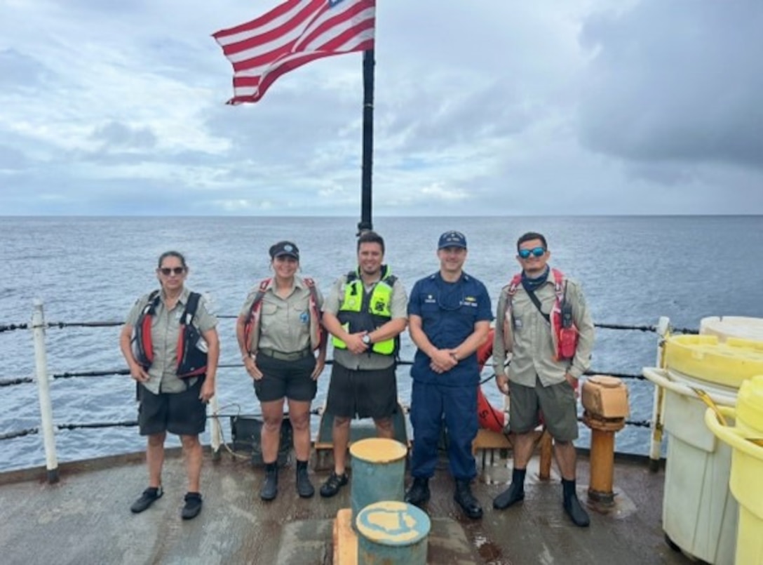 Costa Rican park rangers pose for a photo with Coast Guard Cutter Tampa’s (WMEC 902) commanding officer Cmdr. Joshua DiPietro aboard the Tampa in Isla de Coco, Costa Rica, Nov. 2, 2025. Tampa’s crew deployed in support of counterdrug operations in the Eastern Pacific. (U.S. Coast Guard photo by Ensign Isaac Magee)