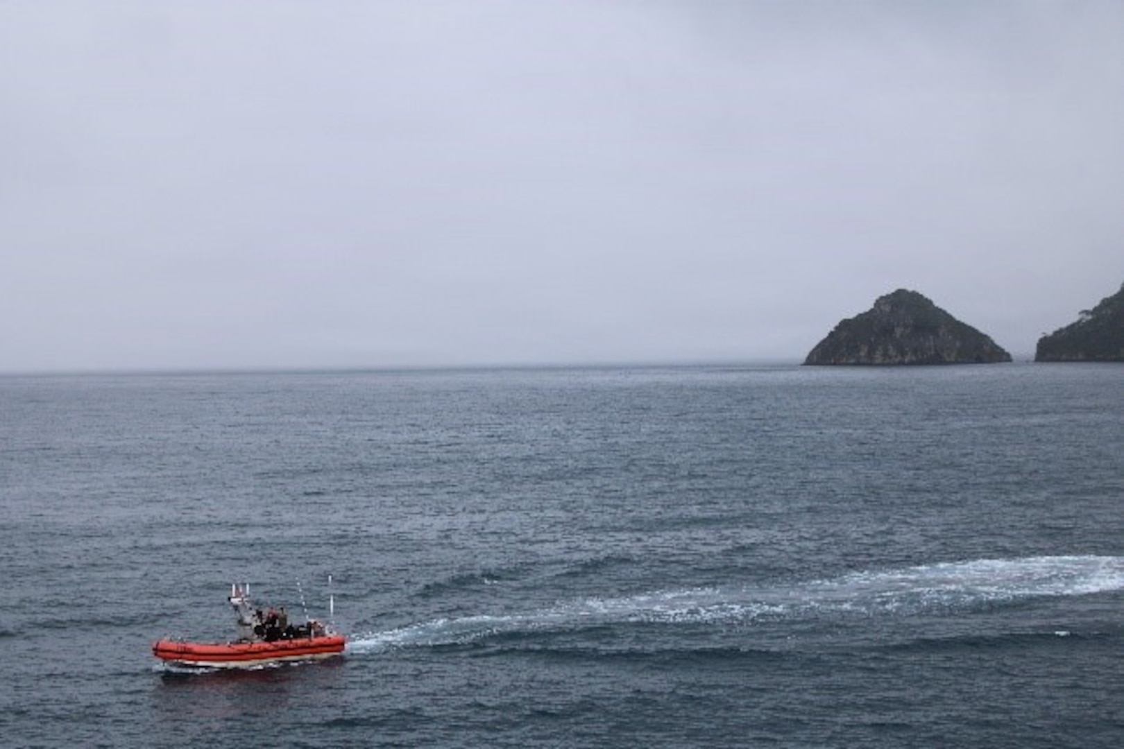 A small boat crew from the Coast Guard Cutter Tampa (WMEC 902) navigates the cutter's over-the-horizon small boat near Isla de Coco, Costa Rica, Nov. 2, 2025. Tampa’s crew deployed in support of counterdrug operations in the Eastern Pacific. (U.S. Coast Guard photo by Ensign Isaac Magee)