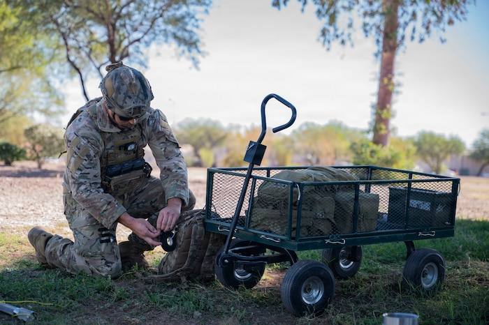 A U.S. Air Force Airman from the 355th Civil Engineer Squadron explosive ordnance disposal technician retrieves equipment during Mosaic Lightning 26-1 at Davis-Monthan Air Force Base, Arizona, Nov. 14, 2025. EOD Airmen were tasked to use precise identification of components to safely render a simulated device inert. (U.S. Air Force photo by Airman 1st Class Samantha Melecio)