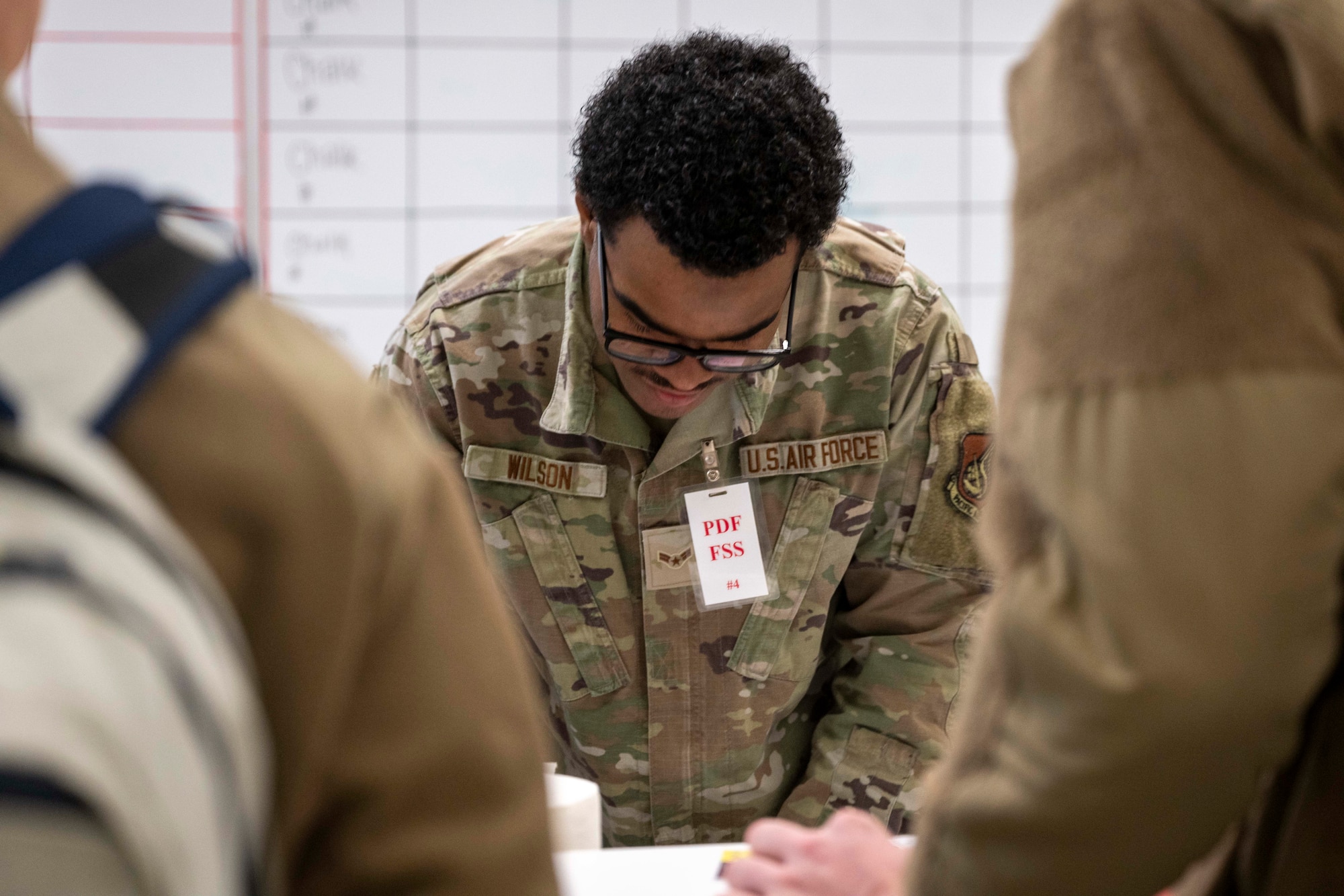 U.S. Air Force Airman 1st Class Myran Wilson, 354th Force Support Squadron force management technician, processes Airmen for a simulated deployment process during Arctic Gold 26-1, at Eielson Air Force Base, Alaska, Nov. 18, 2025.