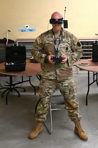 Chief Warrant Officer 2 Nathan Shea, the Unmanned Aircraft Systems operations officer at the Fort Indiantown Gap UAS facility, operates a first-person-view, or FPV, drone on Sept. 2, 2025, at Fort Indiantown Gap, Pennsylvania. (Pennsylvania National Guard photo by Brad Rhen)