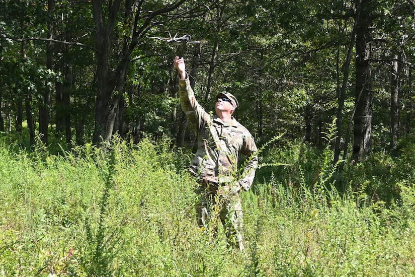 An instructor from the 166th Regiment - Regional Training Institute catches an unmanned aircraft system on Sept. 4, 2025, at Fort Indiantown Gap, Pennsylvania. (Pennsylvania National Guard photo by Brad Rhen)