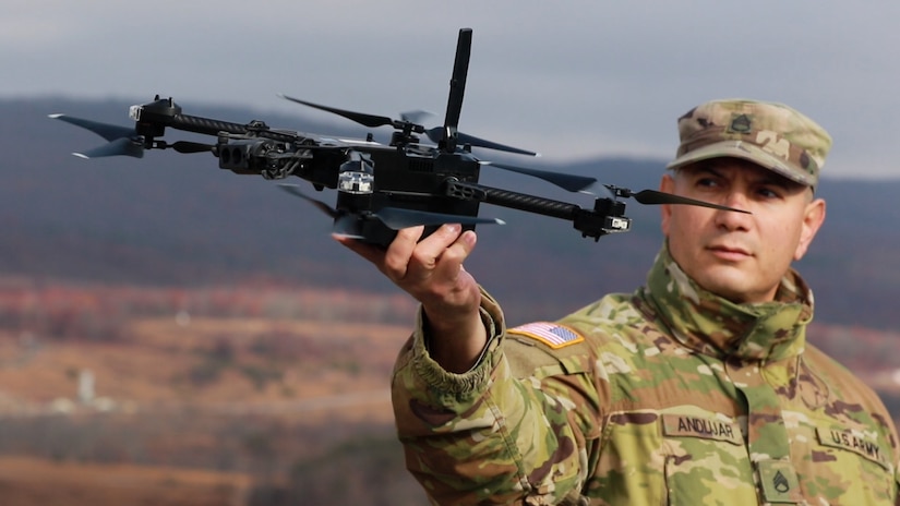 U.S. Army Staff Sgt. Luis Andujar, a Small Unmanned Aircraft Systems instructor with 1st Battalion, 166th Regiment - Regional Training Institute, Pennsylvania Army National Guard, lands a Skydio X2D SUAS during a training exercise Nov. 15, 2024 at Fort Indiantown Gap, Pa. The capabilities of the 166th Regiment RTI's 1st and 2nd Battalions melded during a unique artillery live-fire exercise, during which forward observers with 1st Battalion used several types of SUAS, including commercial off the shelf models like the Skydio X2D, to identify targets and acquire targeting data. This data was used to submit a call for fire to instructors and students with 2nd Battalion, who engaged the targets with artillery fire using M119, M777 and M109A6 howitzers. (U.S. Army National Guard photo by Sgt. 1st Class Shane Smith)