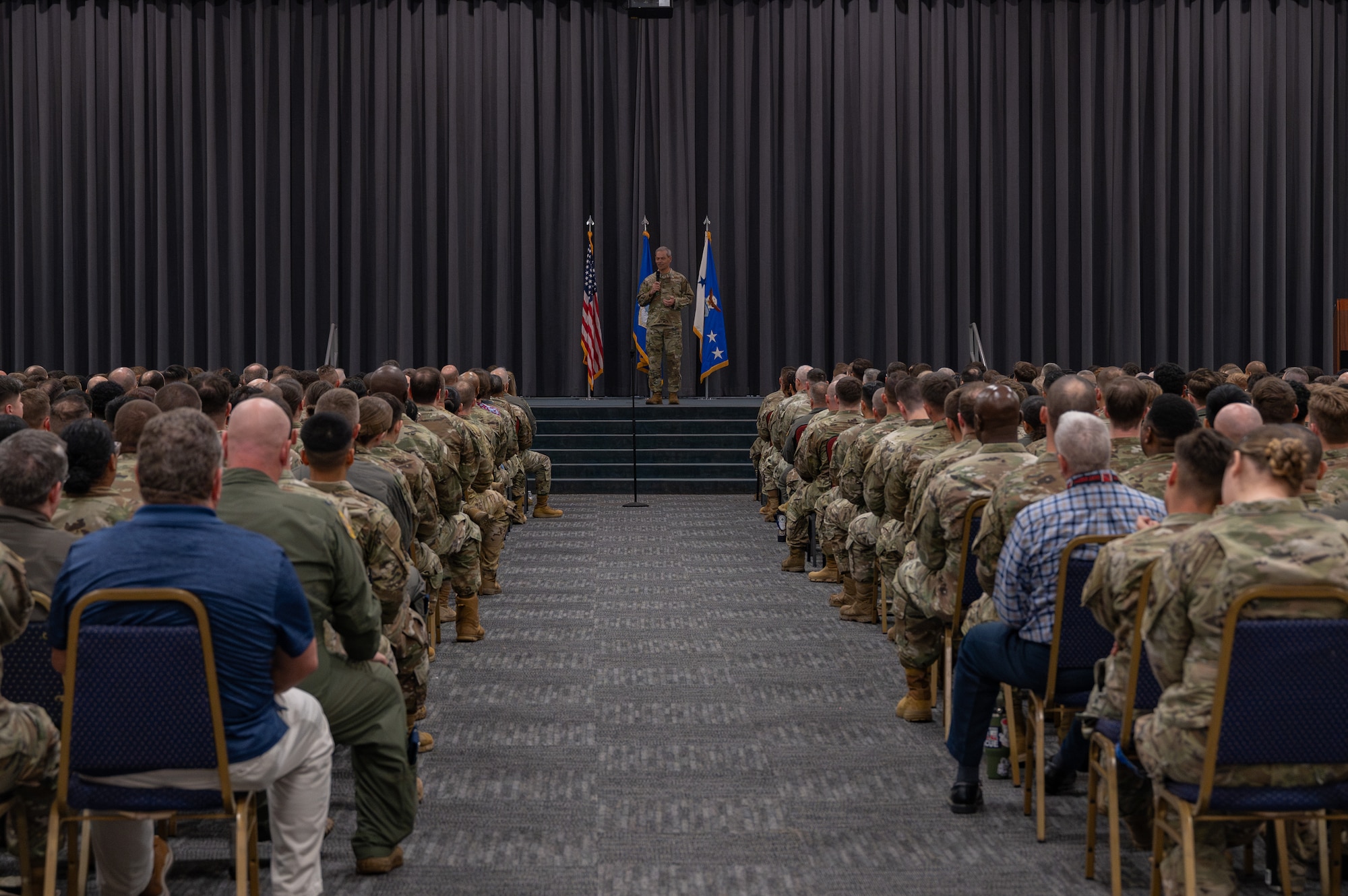 U.S. Air Force Chief of Staff Gen. Ken Wilsbach speaks during an All Call at Barksdale Air Force Base, Louisiana, Nov. 19, 2025, during his first official base visit as CSAF. Wilsbach and his wife Ms. Cindy Wilsbach, visited Barksdale AFB to engage with Air Force Global Strike Command leaders and Airmen, reinforce the need for readiness, and learn about the enduring relevance of the nuclear triad in today’s complex global environment. (U.S. Air Force photo by Senior Airman Laiken King)