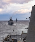 The Republic of Korea (ROK) Navy Chungmugong Yi Sun-sin-class destroyer ROKS Wang Geon (DDG 978), left, and Daegu-class frigate ROKS Daejeon (FFG 823), right, sail in formation aft of Arleigh Burke-class guided-missile destroyer USS Dewey (DDG 105) during the Maritime Counter Special Operations Exercise (MCSOFEX) with the ROK Navy, Nov. 18, 2025.