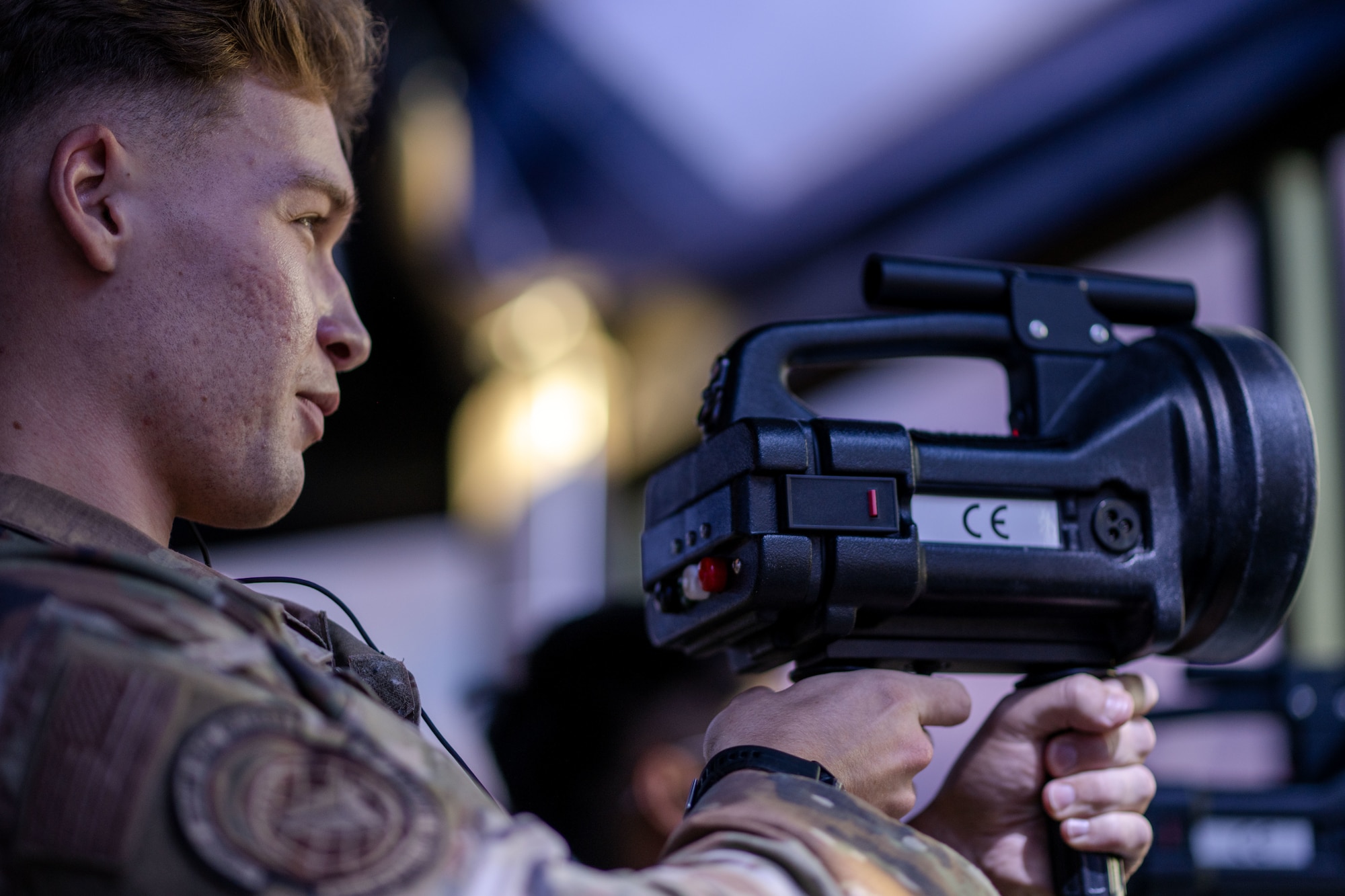 U.S. Air Force Airman 1st Class Daniel Sullivan, 6th Operations Support Squadron air traffic controller, tests light-gun capabilities at MacDill Air Force Base, Florida, Oct. 29, 2025. A light-gun is a contingency response device used during a radio outage. Proficiency on the specialized equipment enables ATC personnel to continue flying operations under degraded conditions. (U.S. Air Force photo by Senior Airman Zachary Foster)