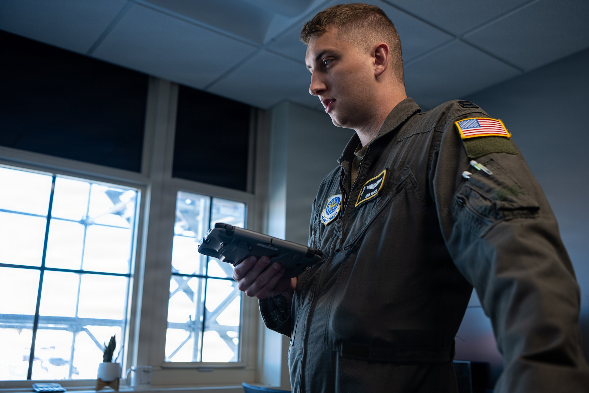 U.S. Air Force Captain Joshua Block, 91st Air Refueling Squadron scheduling officer, reviews aircrew priorities with the assistant director of operations at MacDill Air Force Base, Florida, Nov. 5, 2025. When the aircrew aren’t flying, they are , scheduling  the crews needed to increase the range, lethality and flexibility of combat aircraft. (U.S. Air Force photo by Airman 1st Class Helen Ly)