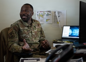 U.S. Air Force Senior Airman Lawrence Carr, 91st Air Refueling Squadron aviation resource manager, converses with aircrew members at MacDill Air Force Base, Florida, Nov. 5, 2025. Carr maintains flight records, validates aircrew safety requirements and ensures the squadron can effectively carry out the mission. (U.S. Air Force photo by Airman 1st Class Helen Ly)