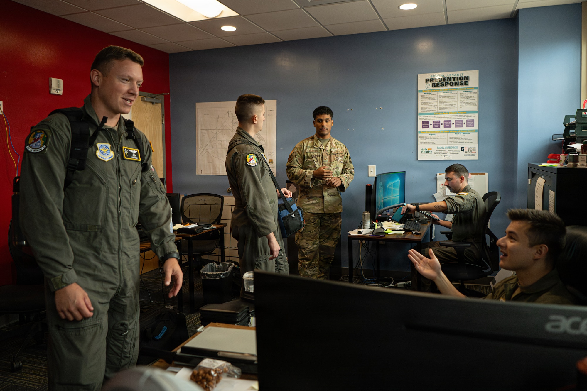 Mobility flight Airmen assigned to the 91st Air Refueling Squadron check readiness items at MacDill Air Force Base, Florida, Nov. 6, 2025. Mobility flight Airmen meet with aviators to ensure all readiness items are complete prior to deployments or temporary duty assignments. (U.S. Air Force photo by Airman 1st Class Helen Ly)