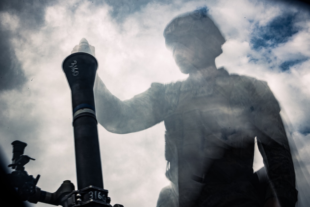 A U.S. Marine with Weapons Company, Battalion Landing Team 1st Battalion, 7th Marine Regiment, 31st Marine Expeditionary Unit, fires an M224 81mm mortar system during live-fire training at Combined Arms Training Center, Camp Fuji, Japan, Sept. 30, 2025. Marines conducted combined arms live-fire training to maintain operational readiness, tactical proficiency, and enhance lethality while operating within the first island chain. The 31st MEU, the Marine Corps’ only continuously forward-deployed MEU, provides a flexible and lethal force ready to perform a wide range of military operations as the premiere crisis response force in the Indo-Pacific region. (U.S. Marine Corps photo by Lance Cpl. Victor Gurrola)