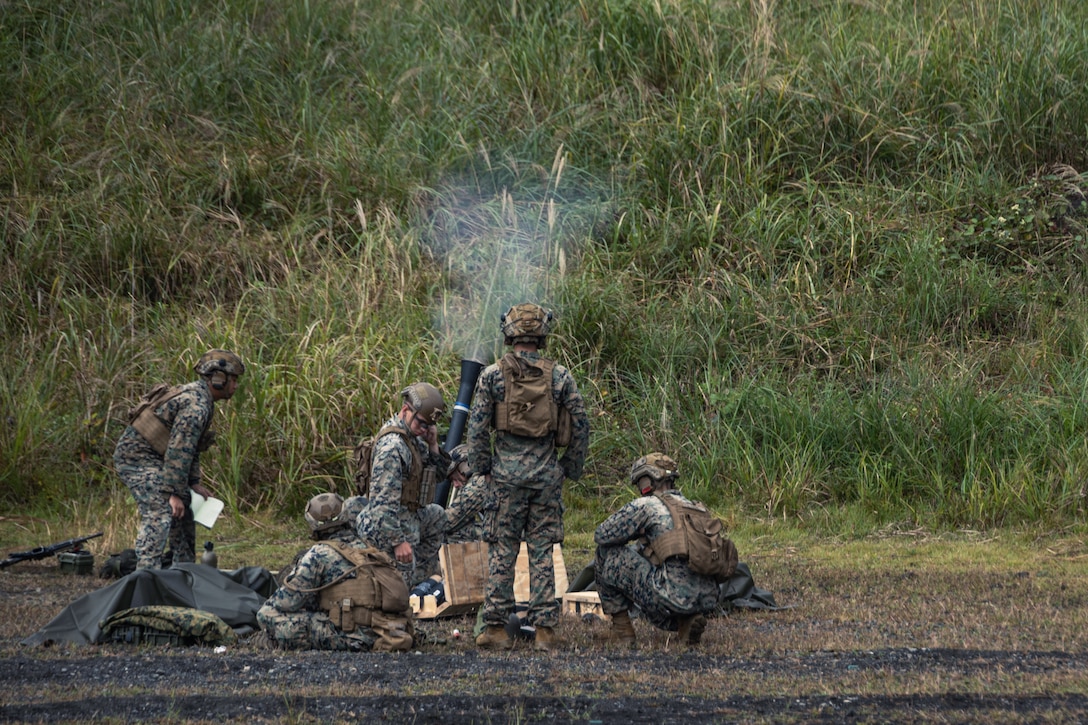 U.S. Marines with Weapons Company, Battalion Landing Team 1st Battalion, 7th Marine Regiment, 31st Marine Expeditionary Unit, fire an M252A2 81mm mortar system during live-fire training at Combined Arms Training Center, Camp Fuji, Japan, Sept. 30, 2025. Marines conducted combined arms live-fire training to maintain operational readiness, tactical proficiency, and enhance lethality while operating within the first island chain. The 31st MEU, the Marine Corps’ only continuously forward-deployed MEU, provides a flexible and lethal force ready to perform a wide range of military operations as the premiere crisis response force in the Indo-Pacific region. (U.S. Marine Corps photo by Lance Cpl. Victor Gurrola)