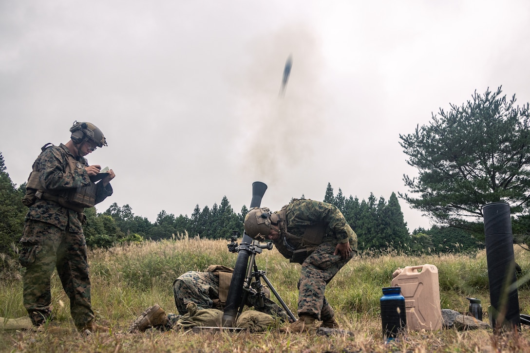 U.S. Marines with Weapons Company, Battalion Landing Team 1st Battalion, 7th Marine Regiment, 31st Marine Expeditionary Unit, fire an M252A2 81mm mortar system during live-fire training at Combined Arms Training Center, Camp Fuji, Japan, Sept. 30, 2025. Marines conducted combined arms live-fire training to maintain operational readiness, tactical proficiency, and enhance lethality while operating within the first island chain. The 31st MEU, the Marine Corps’ only continuously forward-deployed MEU, provides a flexible and lethal force ready to perform a wide range of military operations as the premiere crisis response force in the Indo-Pacific region. (U.S. Marine Corps photo by Lance Cpl. Victor Gurrola)