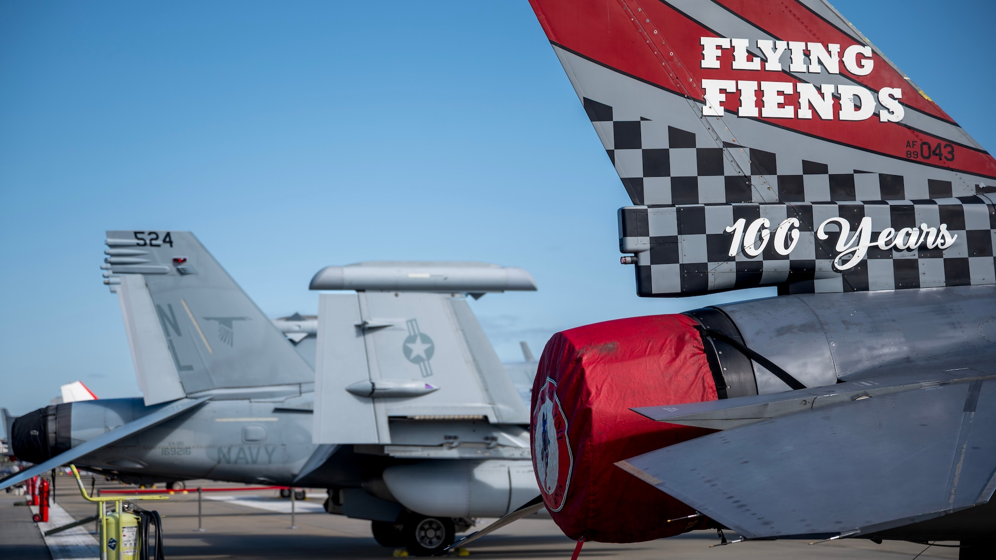 A U.S. Air Force F-16 Fighting Falcon and U.S. Navy EA-18 Growler sit on the flightline during the 2025 Seoul International Aerospace and Defense Exhibition at Seoul Air Base, Republic of Korea, Oct. 17, 2025. Participation in Seoul ADEX 25 demonstrated the U.S.’ robust readiness by showcasing capabilities committed to protecting service members and their families, as well as defending allies and partner nations. (U.S. Air Force photo by Staff Sgt. Sarah Williams)