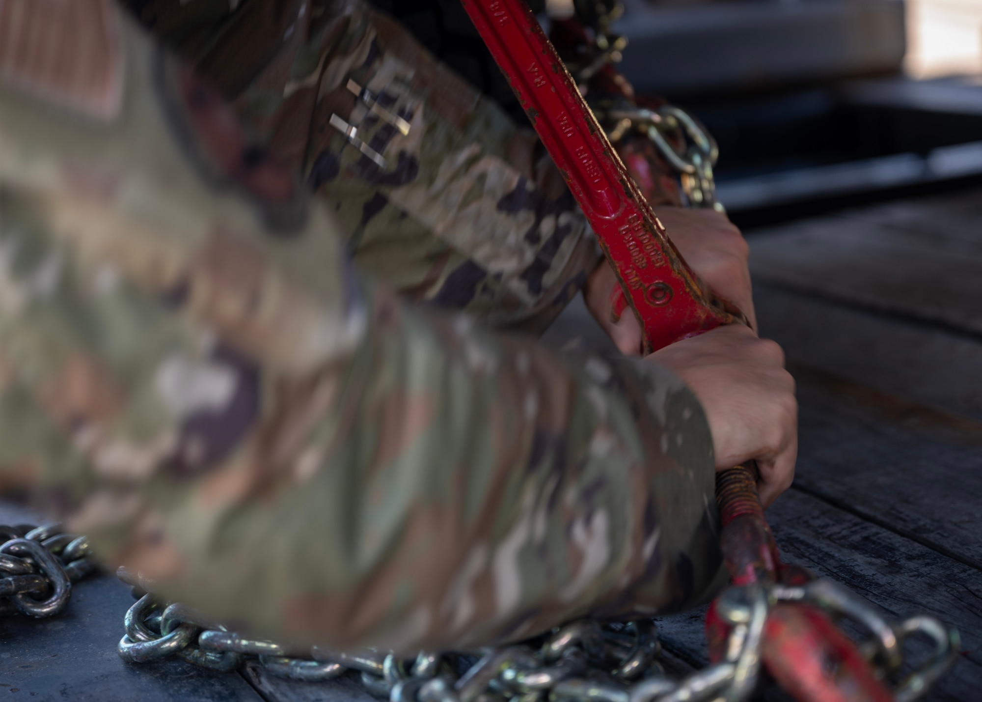 A chain is loosened to release supplies in preparation of the 2025 Seoul International Aerospace and Defense Exhibition at Seoul Air Base, Republic of Korea, Oct. 16, 2025. Seoul ADEX 25 is one of Northeast Asia’s largest and most comprehensive events, bringing together aviation experts, defense leaders, and enthusiasts from around the world. (U.S. Air Force photo by Staff Sgt. Sarah Williams)