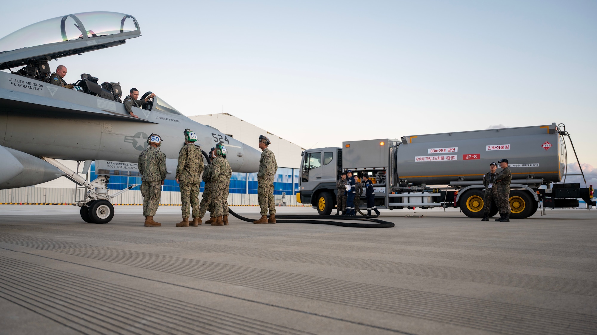 U.S. Navy service members from the Electronic Attack Squadron (VAQ) 135 Black Ravens and Republic of Korea air force 15th Special Mission Wing refuel an EA-18 Growler at Seoul Air Base, ROK, Oct. 16, 2025. The 2025 Seoul International Aerospace and Defense Exhibition reinforced regional stability, enhanced interoperability, and showcased the strength of the U.S.-ROK alliance. (U.S. Air Force photo by Staff Sgt. Sarah Williams)