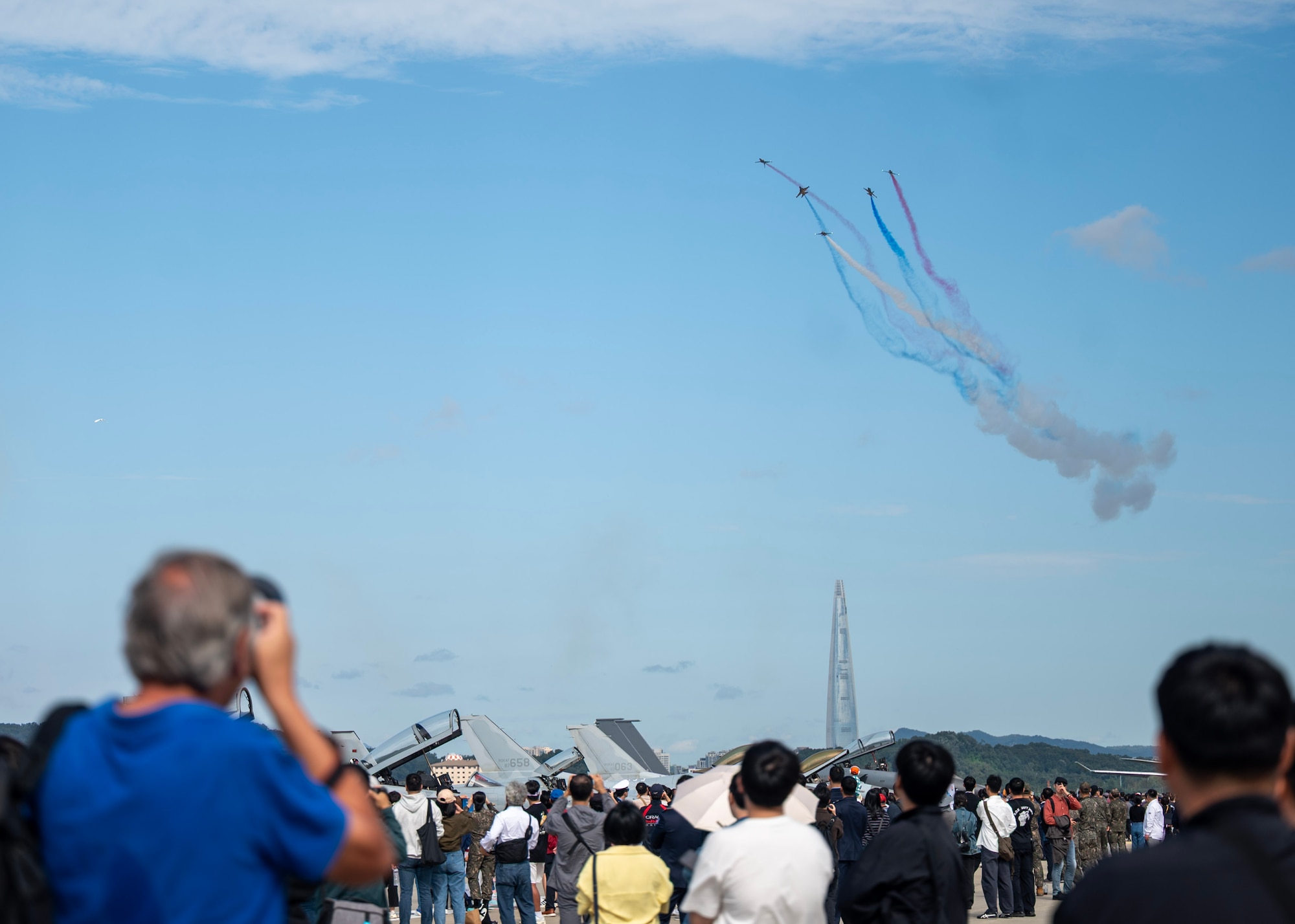 Attendees of the 2025 Seoul International Aerospace and Defense Exhibition watch aerial performances at Seoul Air Base, Republic of Korea, Oct. 17, 2025. Seoul ADEX 25 is one of Northeast Asia’s largest and most comprehensive events, bringing together aviation experts, defense leaders, and enthusiasts from around the world. (U.S. Air Force photo by Staff Sgt. Sarah Williams)