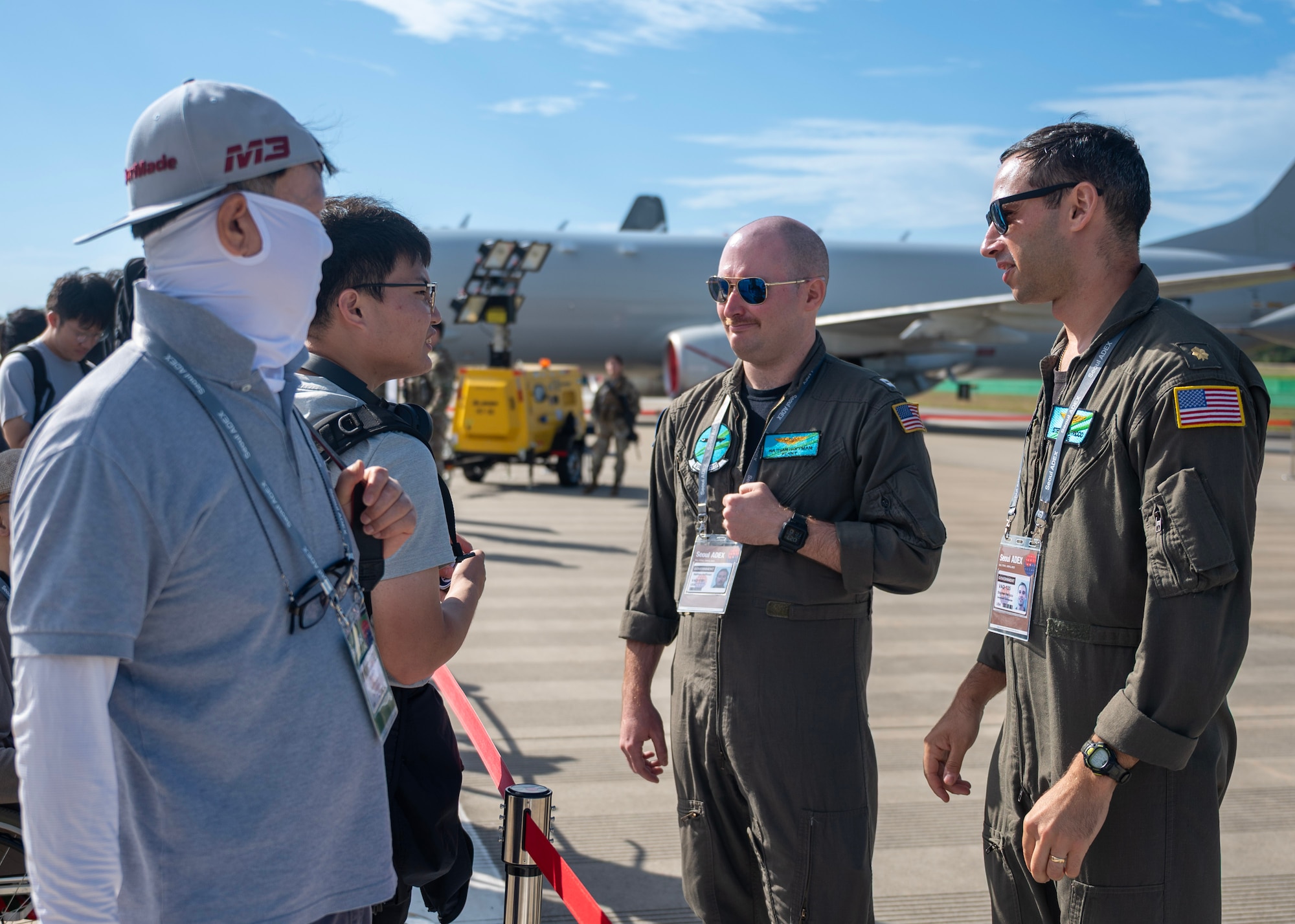 U.S. Navy Electronic Attack Squadron (VAQ) 135 Black Ravens EA-18 Growler electronic warfare officer, center right, and VAQ 135 Black Ravens EA-18 Growler pilot, right, talk to 2025 Seoul International Aerospace and Defense Exhibition attendees at Seoul Air Base, Republic of Korea, Oct. 17, 2025. Participation in Seoul AEDX 25 highlighted the U.S.’ enduring commitment to its allies and partners in the Indo-Pacific region. (U.S. Air Force photo by Staff Sgt. Sarah Williams)