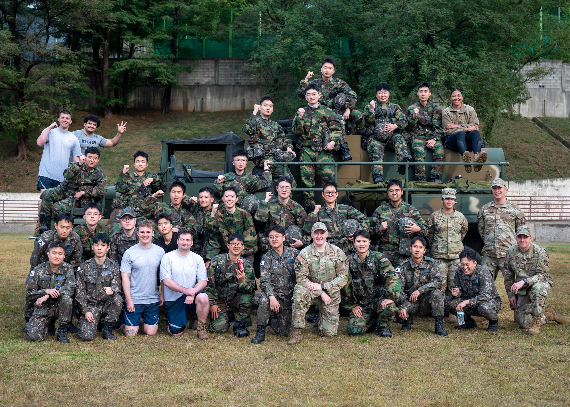 Members of the 51st Civil Engineer Squadron and Republic of Korea Air Force pose for a photo after a chemical, biological, radiological and nuclear exercise at Osan Air Base, ROK, Oct. 30, 2025. The exercise strengthened the U.S.-ROK alliance ensuring Airmen could respond quickly to CBRN threats, protect the base and restore mission capability. (U.S. Air Force photo by Staff Sgt. Sarah Williams)