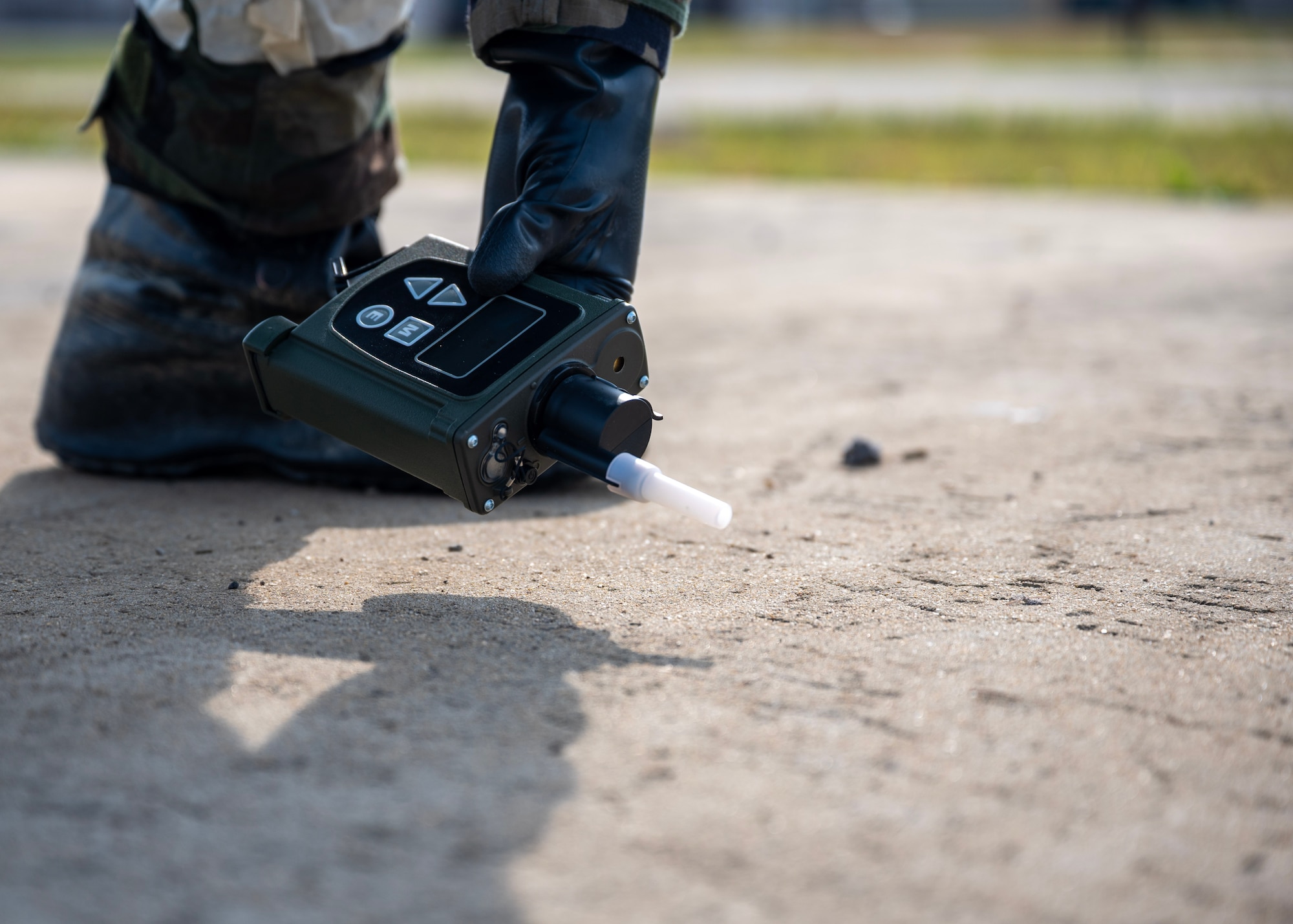A 51st Civil Engineer Squadron uses a chemical detector during a chemical, biological, radiological and nuclear exercise at Osan Air Base, Republic of Korea, Oct. 30, 2025. Members practiced site surveys, sampling and unexploded ordnance protocols to enhance readiness for future contingencies. (U.S. Air Force photo by Staff Sgt. Sarah Williams)