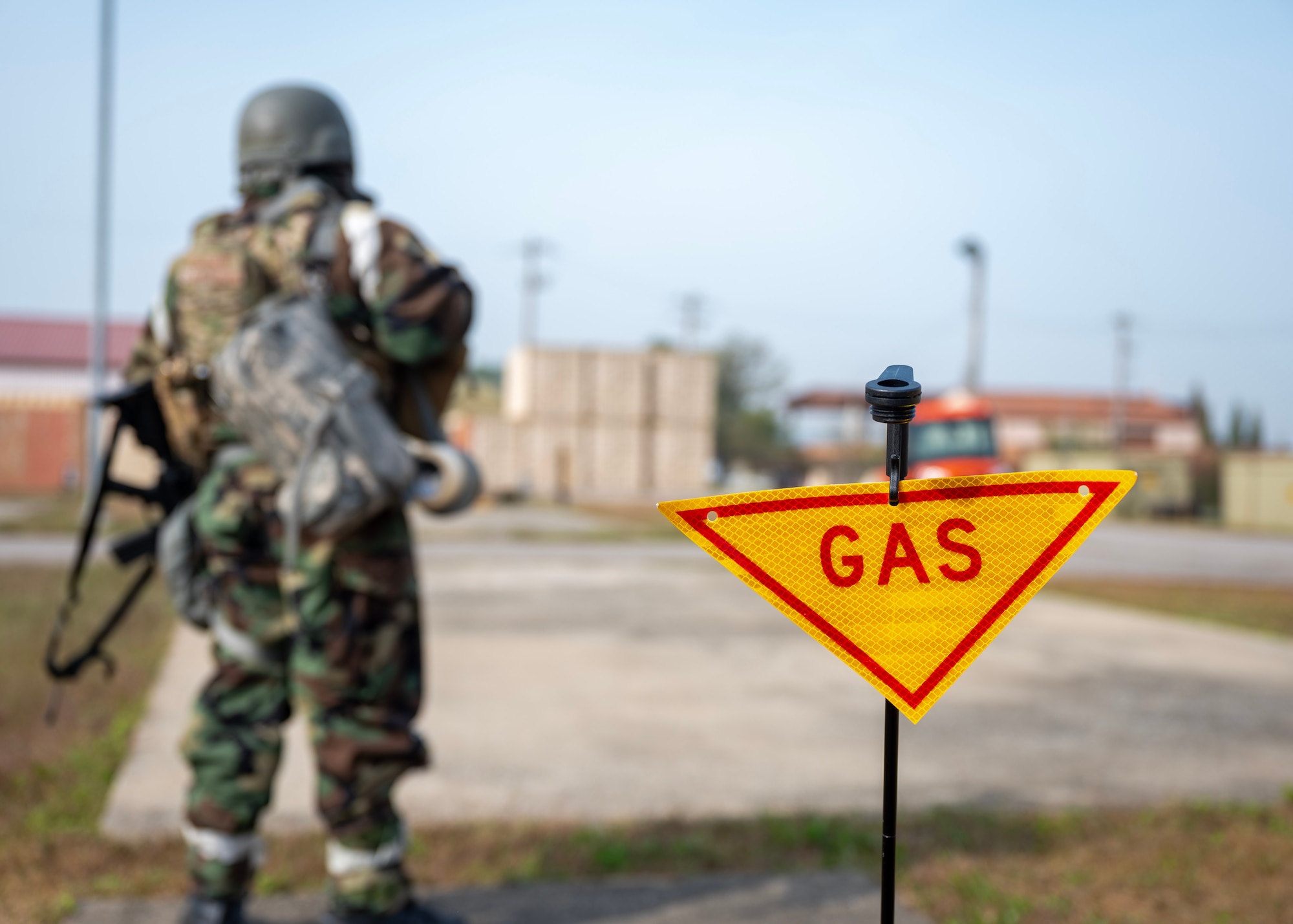 Luis Melendez Gonzalez, 51st Civil Engineer Squadron emergency management logistics, stands behind a gas hazard cordon during a chemical, biological, radiological and nuclear exercise at Osan Air Base, Republic of Korea, Oct. 30, 2025. During the exercise, chemical detection and rapid cordoning were critical to isolating hazards, protecting the base and preventing contamination from spreading. (U.S. Air Force photo by Staff Sgt. Sarah Williams)