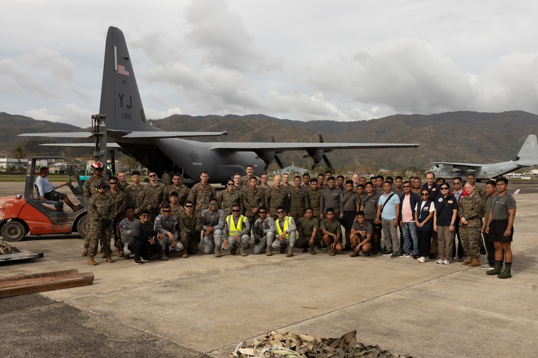 Armed Forces of the Philippines service members and U.S. Marines with the 15 Marine Expeditionary Unit, I Marine Expeditionary Force; 3d Marine Expeditionary Brigade, III MEF; and 1st Marine Aircraft Wing, III MEF, pose for a group photograph during foreign disaster relief operations at Virac, Philippines, Nov. 15, 2025. At the request of the Government of the Philippines, the U.S. military is working alongside the Armed Forces of the Philippines to provide foreign disaster relief support to communities affected by consecutive Typhoons Kalmaegi (Tino) and Fung-Wong (Uwan), which caused extensive damage and tragic loss of life. The forward presence and ready posture of United States Indo-Pacific Command in the region facilitates rapid and effective response to crisis, demonstrating the U.S.’s commitment to Allies and partners during times of need. (U.S. Marine Corps photo by Sgt. Nicholas A. Cox)