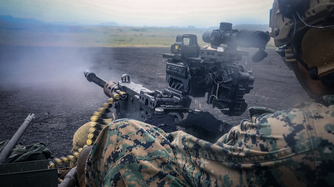 U.S. Marines with Weapons Company, Battalion Landing Team 1st Battalion, 7th Marine Regiment, 31st Marine Expeditionary Unit, fire an M2 Browning .50-caliber machine gun equipped with a heavy machine gun sighting system during live-fire training at Combined Arms Training Center, Camp Fuji, Japan, Oct. 1, 2025. Marines conducted combined arms live-fire training to maintain operational readiness, tactical proficiency, and enhance lethality while operating within the first island chain. The 31st MEU, the Marine Corps’ only continuously forward-deployed MEU, provides a flexible and lethal force ready to perform a wide range of military operations as the premiere crisis response force in the Indo-Pacific region. (U.S. Marine Corps photo by Lance Cpl. Victor Gurrola)
