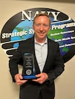 Scott Thompson receives a Defense Department Financial Award for implementing Robotic Automation Solutions in Washington D.C., in August 2025.