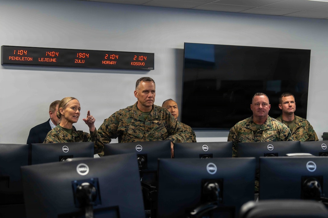 U.S. Marine Corps Brig. Gen. Maura M. Hennigan, 2nd Marine Logistics Group commanding general, left, gives feedback to Lt. Gen. Eric Austin, Combat Development and Integration deputy commandant, on the performance of the Maven Smart System at Marine Corps Base Camp Lejeune, North Carolina, Nov. 20, 2025. Austin met with leaders of 2nd MLG to speak about force design and 2nd MLG’s capabilities and efforts to innovate as well as touring the II Marine Expeditionary Force innovation campus. (U.S. Marine Corps photo by Sgt. Rafael Brambila-Pelayo)