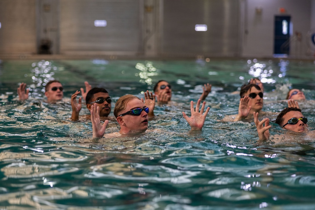 U.S. Marines with 2nd Combat Readiness Regiment, 2nd Marine Logistics Group, practice in-water treading during a water survival advanced course at Marine Corps Base Camp Lejeune, North Carolina, Nov. 20, 2025. Marine Corps instructors in water survival taught 2nd MLG Marines advanced techniques in case of a moan overboard, shipwreck or rescue situation while at sea. (U.S. Marine Corps photo by Lance Cpl. Talan Werner)