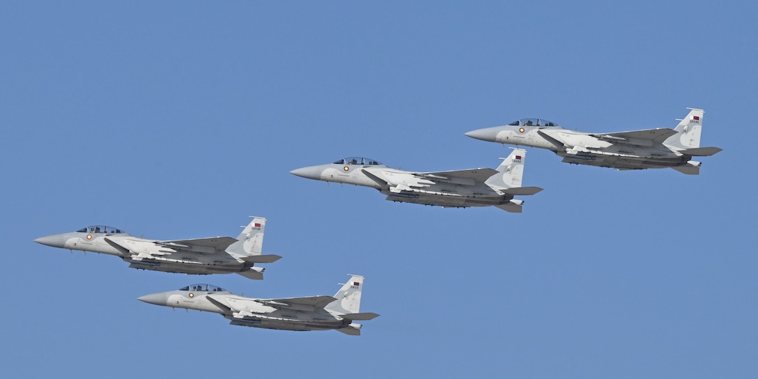 A Qatar Emiri Air Force F-15QAs flyover during exercise Ferocious Falcon live-fire demonstration within the U.S. Central Command area of responsibility, Nov. 20, 2025. Ferocious Falcon 6 is a biennial, Qatar-hosted multinational joint exercise designed to enhance lethality and combat efficiency among U.S. and allied forces. (U.S. Air Force photo by Senior Master Sgt. Richard P. Ebensberger)