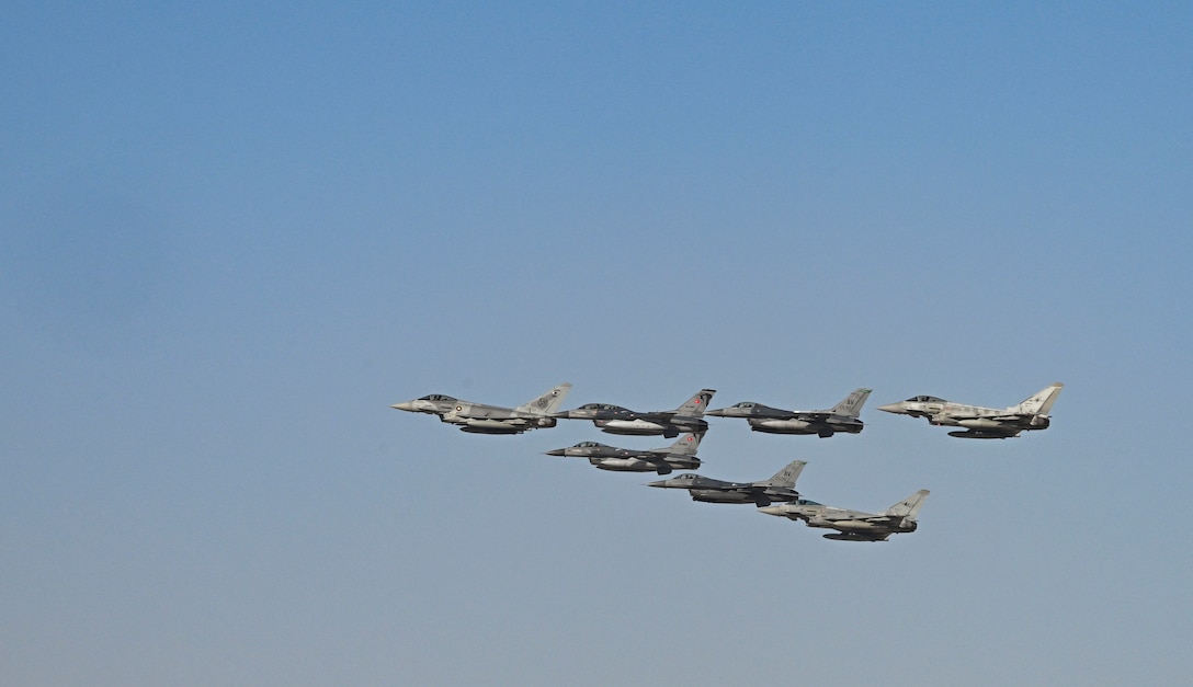 Military aircraft from the U.S. Qatar, Italy, the United Kingdom, Turkey and France flyover during exercise Ferocious Falcon 6 within the U.S. Central Command area of responsibility, Nov. 20, 2025. Ferocious Falcon 6 is a biennial, Qatar-hosted multinational joint exercise designed to enhance lethality and combat efficiency among U.S. and allied forces. (U.S. Air Force photo by Senior Master Sgt. Richard P. Ebensberger)