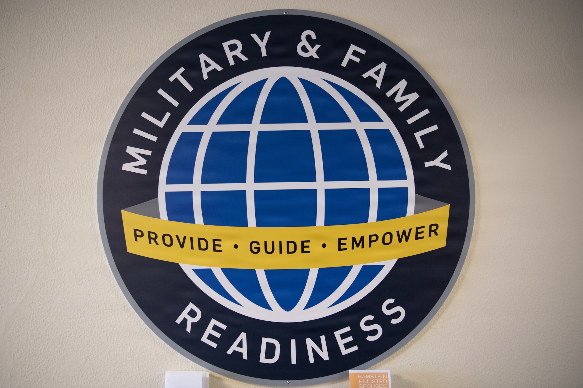 The Military and Family Readiness Center emblem displays their mission motto.