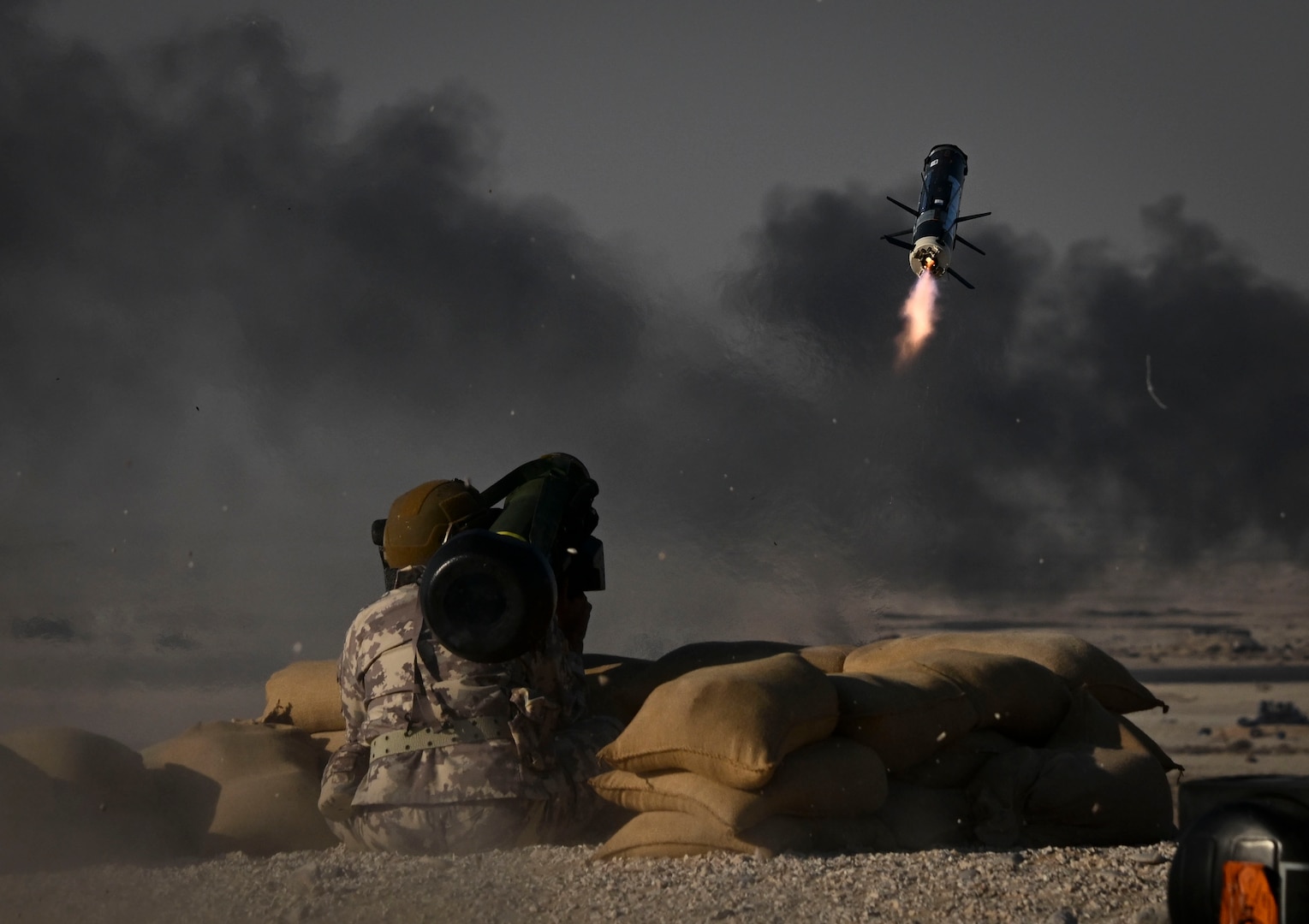 A member of the Qatar military fires a Javelin shoulder-fired anti-tank missile during the exercise Ferocious Falcon live-fire demonstration within the U.S. Central Command area of responsibility, Nov. 20, 2025. Ferocious Falcon 6 is a biennial, Qatar-hosted multinational joint exercise designed to enhance lethality and combat efficiency among U.S. and allied forces. (U.S. Air Force photo by Senior Master Sgt. Richard P. Ebensberger)