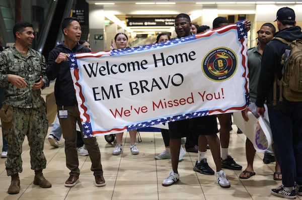 SAN DIEGO (Oct. 16, 2025) – Expeditionary Medical Facility 150-Bravo from Navy Medicine Readiness and Training Command San Diego joins in welcoming Navy Expeditionary Medical Unit 10 Gulf (EMU-10G) Sailors home at San Diego International Airport. EMU 10G supported State Department personnel during the "12-Day War" and the evacuation of State Department personnel. (U.S. Navy photo by Arsenio R. Cortez Jr.)