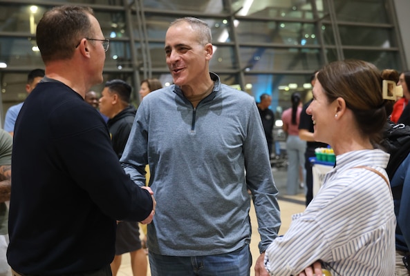 SAN DIEGO (Oct. 16, 2025) – Rear Adm. Kevin Brown, commander of Naval Medical Forces Pacific, and Capt. Shannan Rotruck, executive officer of Expeditionary Medical Facility 150-Bravo, greet Capt. Jonas Carmichael, officer-in-charge of Navy Expeditionary Medical Unit 10 Gulf (EMU-10G), after the unit’s arrival at San Diego International Airport. Brown stated that the EMU's "effective delivery of Role 2 care...significantly enhancing the health and readiness of our personnel and coalition allies." (U.S. Navy photo by Arsenio R. Cortez Jr.)